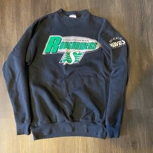 Authentic Saskatchewan Roughriders sweatshirt. Vintage- fits like a men’s small.